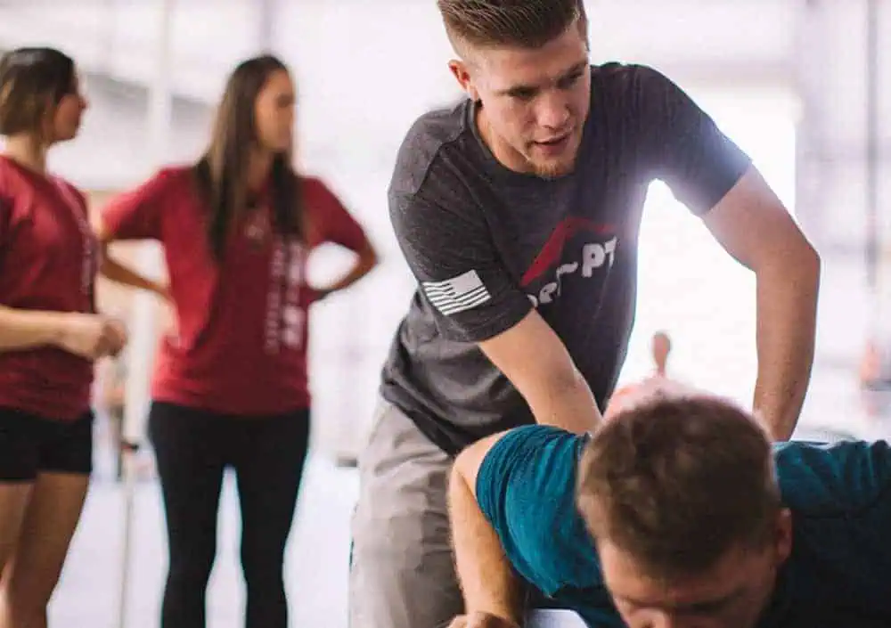 Physical therapist providing treatment to a patient during a therapy session.