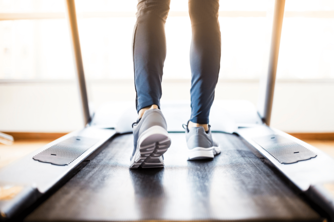Person using a treadmill while experiencing pain