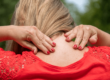 Woman dealing with stiff neck pain
