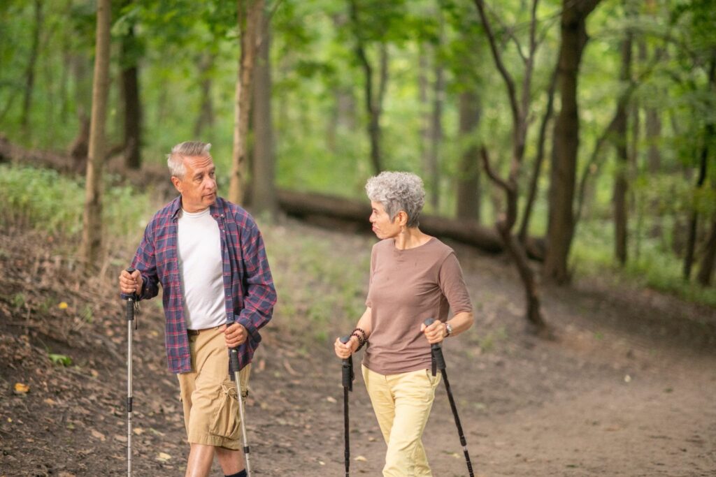 Senior couple hiking in the forest