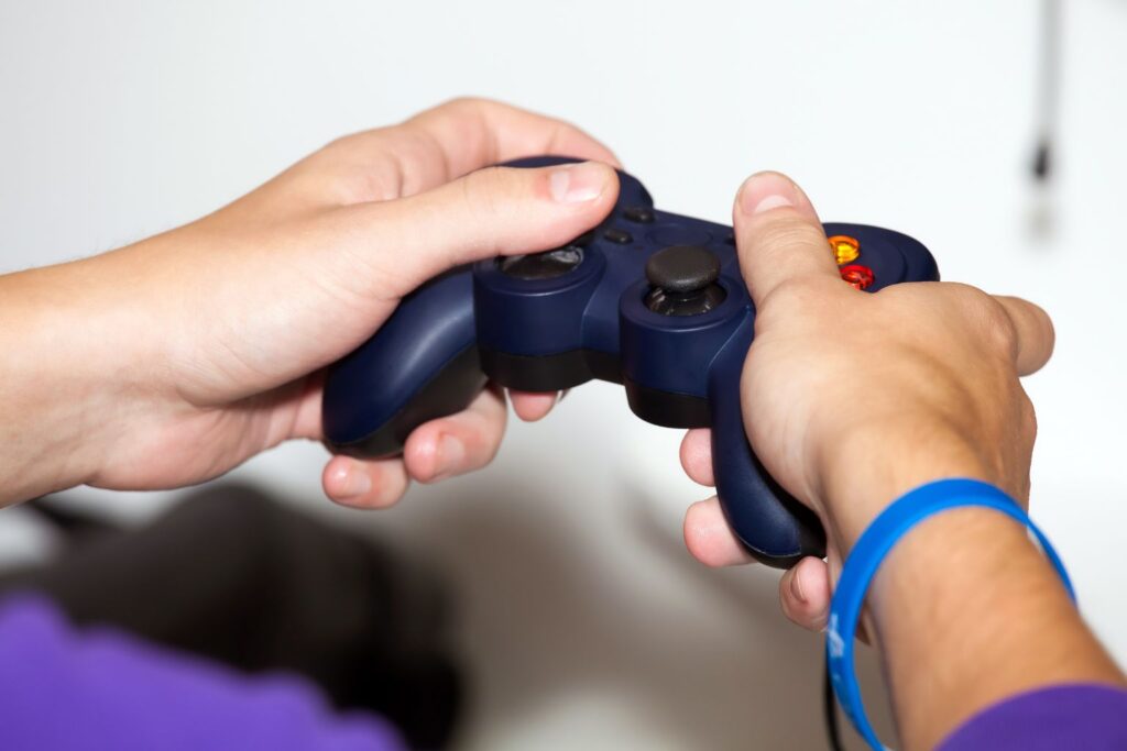 Closeup of hands using a video game console controller