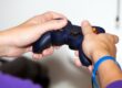 Closeup of hands using a video game console controller