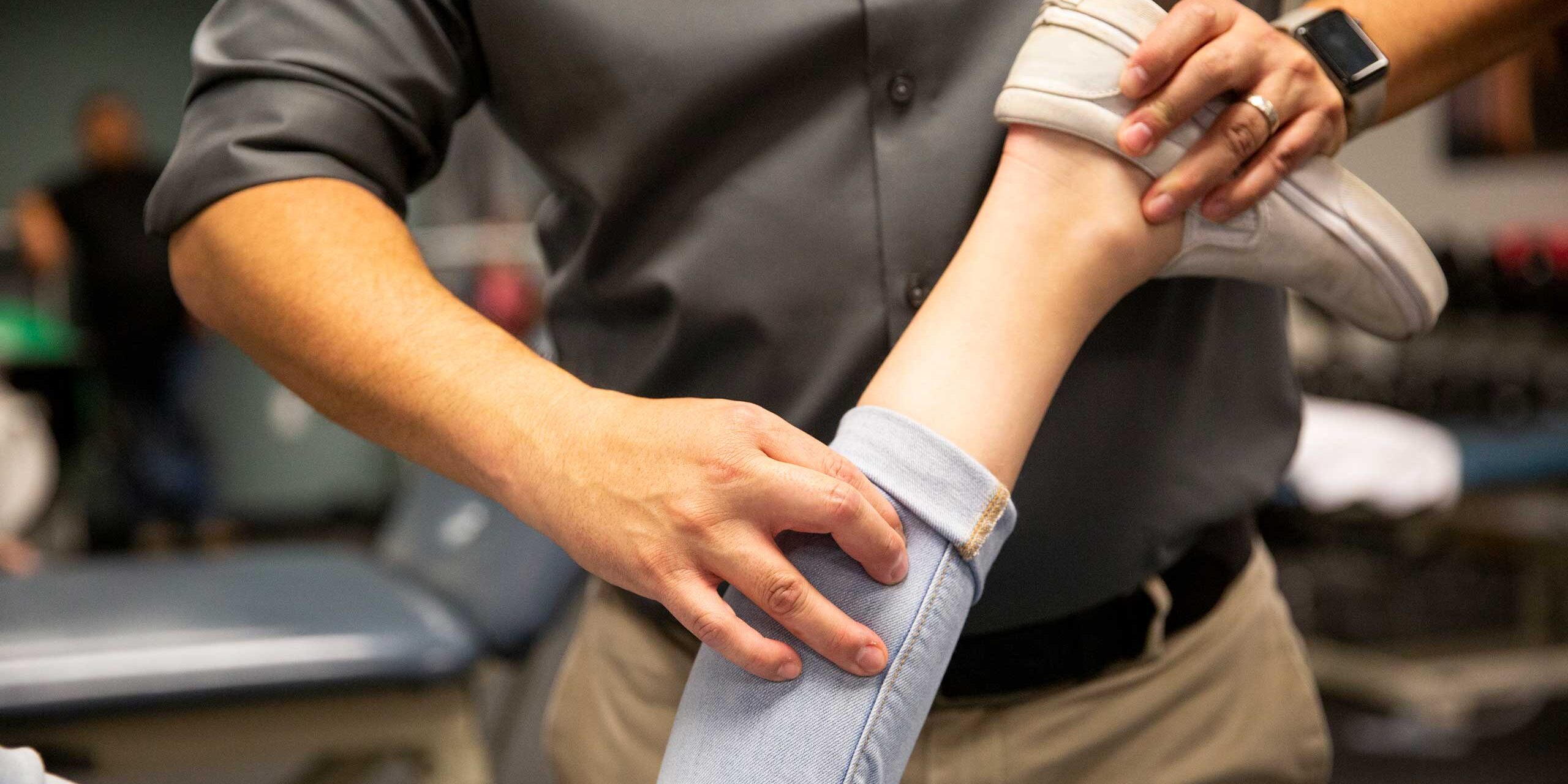 Physical therapist working on a dancers leg