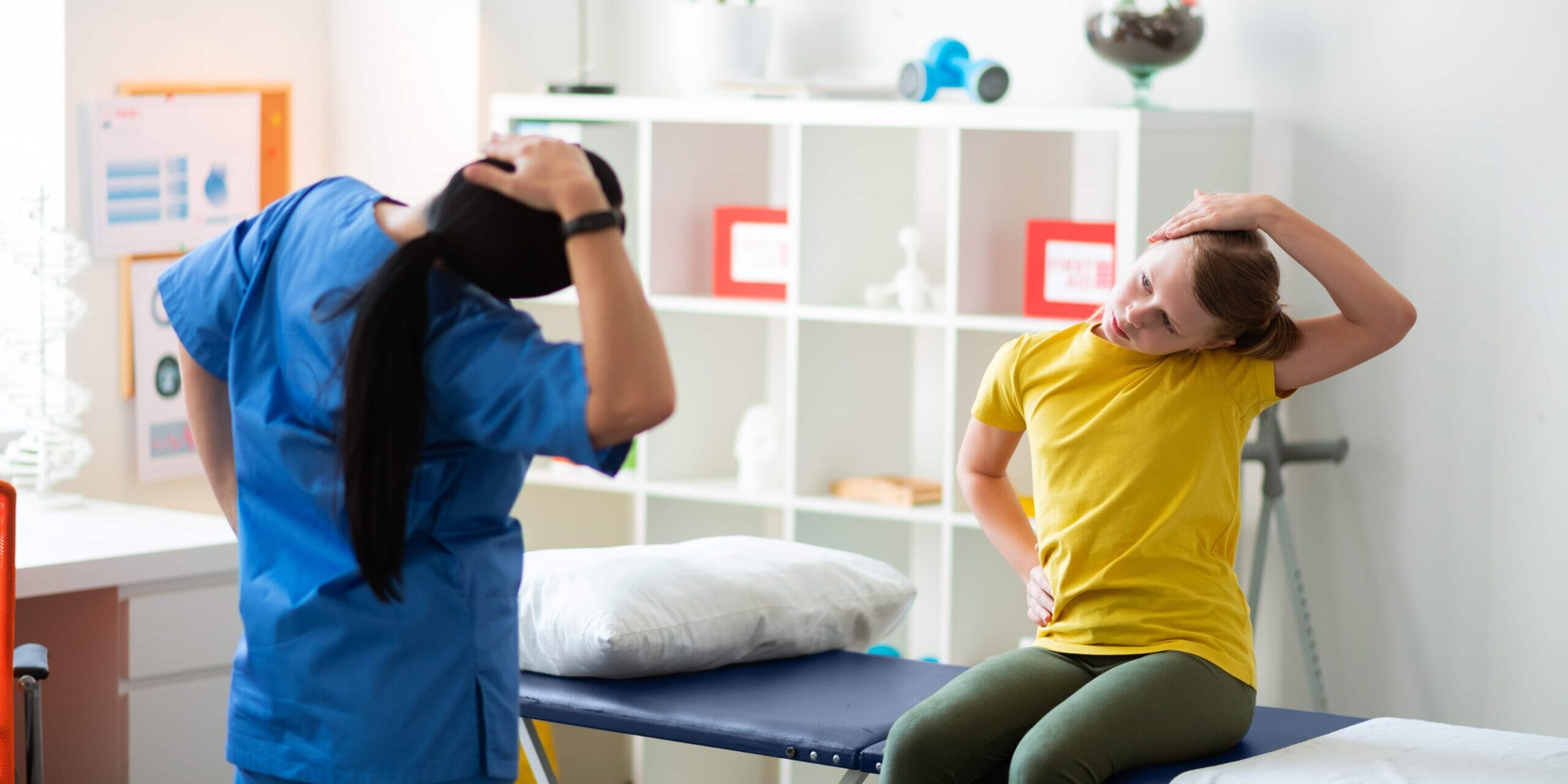 Therapist performing head and neck exercises with patient.